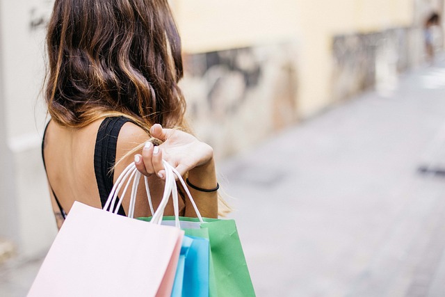 woman carrying shopping bags over her shoulder; visualizes retail therapy as a coping mechanism preventing her to reclaim her motherhood